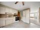 Traditional kitchen with white cabinets, modern appliances, and ample counter space at 3626 St. Charles St, Anderson, IN 46013