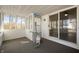 The sunroom with multiple windows, a sliding glass door, and indoor-outdoor carpeting at 3626 St. Charles St, Anderson, IN 46013