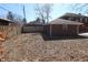 Exterior shot of the backyard, showing the lawn, fence, and a single car garage at 3645 N Delaware St, Indianapolis, IN 46205