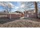 Backyard view showing brick house, garage, and patio at 3645 N Delaware St, Indianapolis, IN 46205