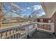 Balcony with white railing and views of the surrounding neighborhood trees at 3645 N Delaware St, Indianapolis, IN 46205