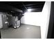 Unfinished basement area with brick walls, concrete flooring, and mechanical equipment at 3645 N Delaware St, Indianapolis, IN 46205