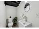 Contemporary bathroom features a sleek vanity, toilet, and modern fixtures at 3645 N Delaware St, Indianapolis, IN 46205