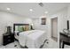 Cozy bedroom with tiled floors, recessed lighting, and a comfortable bed at 3645 N Delaware St, Indianapolis, IN 46205