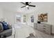Comfortable bedroom with neutral carpet, good natural light, ceiling fan, and calm decor at 3645 N Delaware St, Indianapolis, IN 46205