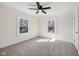 Sunlit bedroom featuring neutral carpet, ceiling fan, and white trim at 3645 N Delaware St, Indianapolis, IN 46205