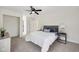 Spacious bedroom with neutral carpet, ceiling fan, and comfortable decor with good natural light at 3645 N Delaware St, Indianapolis, IN 46205