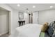 Bright bedroom with stylish console table and plush, white bedspread at 3645 N Delaware St, Indianapolis, IN 46205