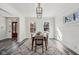 Elegant dining room featuring a modern chandelier, natural lighting, and stylish decor for comfortable meals at 3645 N Delaware St, Indianapolis, IN 46205