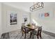 Bright dining room with modern lighting, natural light, and neutral decor, creating an inviting space at 3645 N Delaware St, Indianapolis, IN 46205