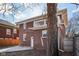 Brick two-story home with a rear balcony and access to backyard at 3645 N Delaware St, Indianapolis, IN 46205