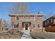 Charming two-story brick home featuring a beautiful walkway, covered porch, and ample windows for natural light at 3645 N Delaware St, Indianapolis, IN 46205
