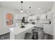 Modern kitchen featuring white cabinets, stainless steel appliances, and a large center island with bar seating at 3645 N Delaware St, Indianapolis, IN 46205