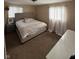 A peaceful bedroom featuring plush carpet, natural light, and soothing neutral tones at 3703 Church Dr, Anderson, IN 46013