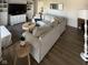 Open-concept living room with stylish furniture, wood floors, neutral color palette, and ample space at 3703 Church Dr, Anderson, IN 46013