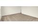 A carpeted room with neutral walls and a doorway to another room at 3917 Wren Dr, Brownsburg, IN 46112