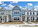 Charming townhomes featuring stone accents and inviting front doors in a vibrant community at 3917 Wren Dr, Brownsburg, IN 46112