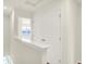 Hallway view with a double-door closet and open doorway to another room at 3917 Wren Dr, Brownsburg, IN 46112