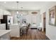 Modern kitchen with white countertops, stainless steel appliances, and a breakfast bar with stools at 3917 Wren Dr, Brownsburg, IN 46112