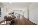 Open-concept kitchen and dining area with white cabinetry and seating, perfect for gatherings at 3917 Wren Dr, Brownsburg, IN 46112