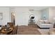 Well-lit living area with hardwood floors, neutral furniture, and adjacent dining for comfortable living at 3917 Wren Dr, Brownsburg, IN 46112
