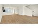 Open-concept living area with hardwood floors, staircase, and ample space for entertainment at 3917 Wren Dr, Brownsburg, IN 46112