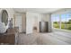 Main bedroom with a large window, dresser, and attached closet and bathroom at 3917 Wren Dr, Brownsburg, IN 46112