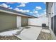Back patio with view of exterior walls, access door, air conditioner, and newly installed concrete pad at 3917 Wren Dr, Brownsburg, IN 46112