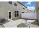 Back patio with view of exterior walls, access door, air conditioner, and newly installed concrete pad at 3917 Wren Dr, Brownsburg, IN 46112