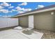 Back patio with view of exterior walls, access door, and newly installed concrete pad at 3917 Wren Dr, Brownsburg, IN 46112