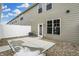 Back patio with view of exterior walls, access door, air conditioner, and newly installed concrete pad at 3917 Wren Dr, Brownsburg, IN 46112