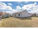 Backyard featuring a shed and a sliding glass door that leads to the patio, with a grassy area at 4313 Strawflower Dr, Indianapolis, IN 46203