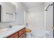 Bathroom featuring a vanity with sink, toilet and shower-tub combo, creating a functional space at 4313 Strawflower Dr, Indianapolis, IN 46203