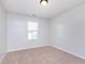 Bright bedroom with a window and neutral carpet, offering a serene and comfortable space at 4313 Strawflower Dr, Indianapolis, IN 46203