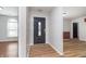 Welcoming entryway with decorative front door and bright, neutral paint at 4313 Strawflower Dr, Indianapolis, IN 46203