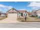 Charming brick home featuring an attached two car garage and well-maintained lawn at 4313 Strawflower Dr, Indianapolis, IN 46203