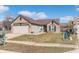 Charming brick home with covered entry, well-maintained lawn, and attached garage at 4313 Strawflower Dr, Indianapolis, IN 46203