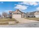 Charming brick home featuring an attached two car garage and well-maintained lawn at 4313 Strawflower Dr, Indianapolis, IN 46203