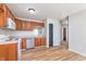 Cozy kitchen with wooden cabinets, white appliances, and vinyl flooring at 4313 Strawflower Dr, Indianapolis, IN 46203