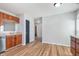Cozy kitchen with wooden cabinets, white appliances, and vinyl flooring at 4313 Strawflower Dr, Indianapolis, IN 46203