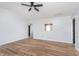 Living room with hardwood floors, ceiling fan, and doorway to another room, great for entertaining at 4313 Strawflower Dr, Indianapolis, IN 46203