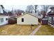 Backyard featuring a quaint yard, a well-maintained walkway, and mature trees for a serene outdoor space at 4619 Carrollton Ave, Indianapolis, IN 46205