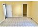 Bedroom featuring linoleum flooring and access to an ensuite bathroom and walk-in closet at 4619 Carrollton Ave, Indianapolis, IN 46205