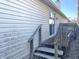 This home has a wooden deck with stairs, offering outdoor enjoyment and easy access to the yard at 4619 Carrollton Ave, Indianapolis, IN 46205