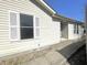 View of home front with vinyl siding and a sidewalk leading to the front door at 4619 Carrollton Ave, Indianapolis, IN 46205