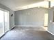 Bright living room featuring sliding doors, a chandelier, and open layout perfect for modern living and entertaining at 4619 Carrollton Ave, Indianapolis, IN 46205