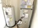 Mechanical room with a hot water heater and HVAC unit at 4619 Carrollton Ave, Indianapolis, IN 46205