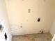 Utility area with an electrical outlet and plumbing fixtures in need of repair at 4619 Carrollton Ave, Indianapolis, IN 46205