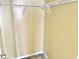 A yellow walk-in closet with white wire shelving provides efficient storage and organization solutions at 4619 Carrollton Ave, Indianapolis, IN 46205