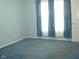 Cozy bedroom with blue walls, blue carpet and window with blue curtains at 515 Bridgestone Dr, Mooresville, IN 46158